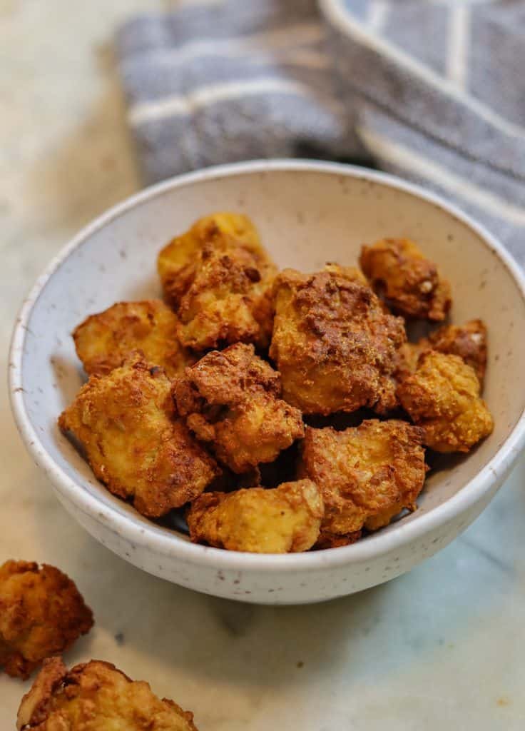 cirspy tofu air fried in a small bowl.