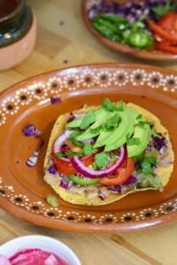 tostadas de papa potato tostada on a mexican plate.