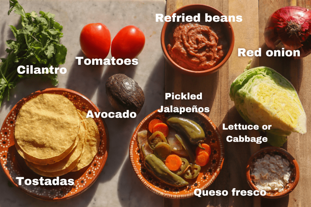 ingredients for bean tostadas on a cutting board.