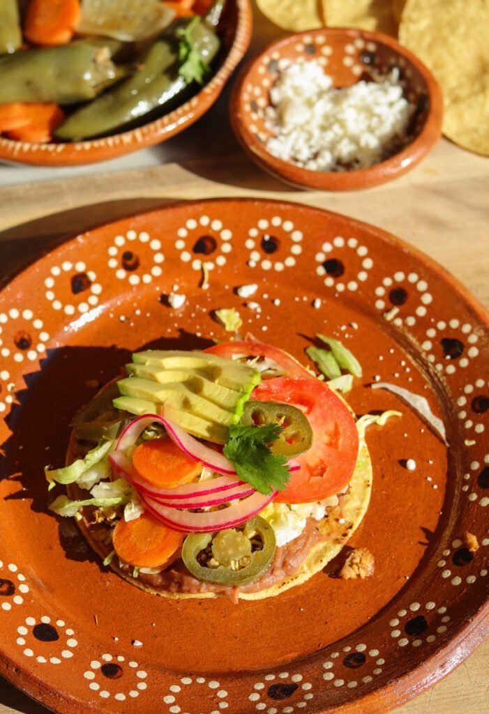 delicious tostada on a mexican plate.