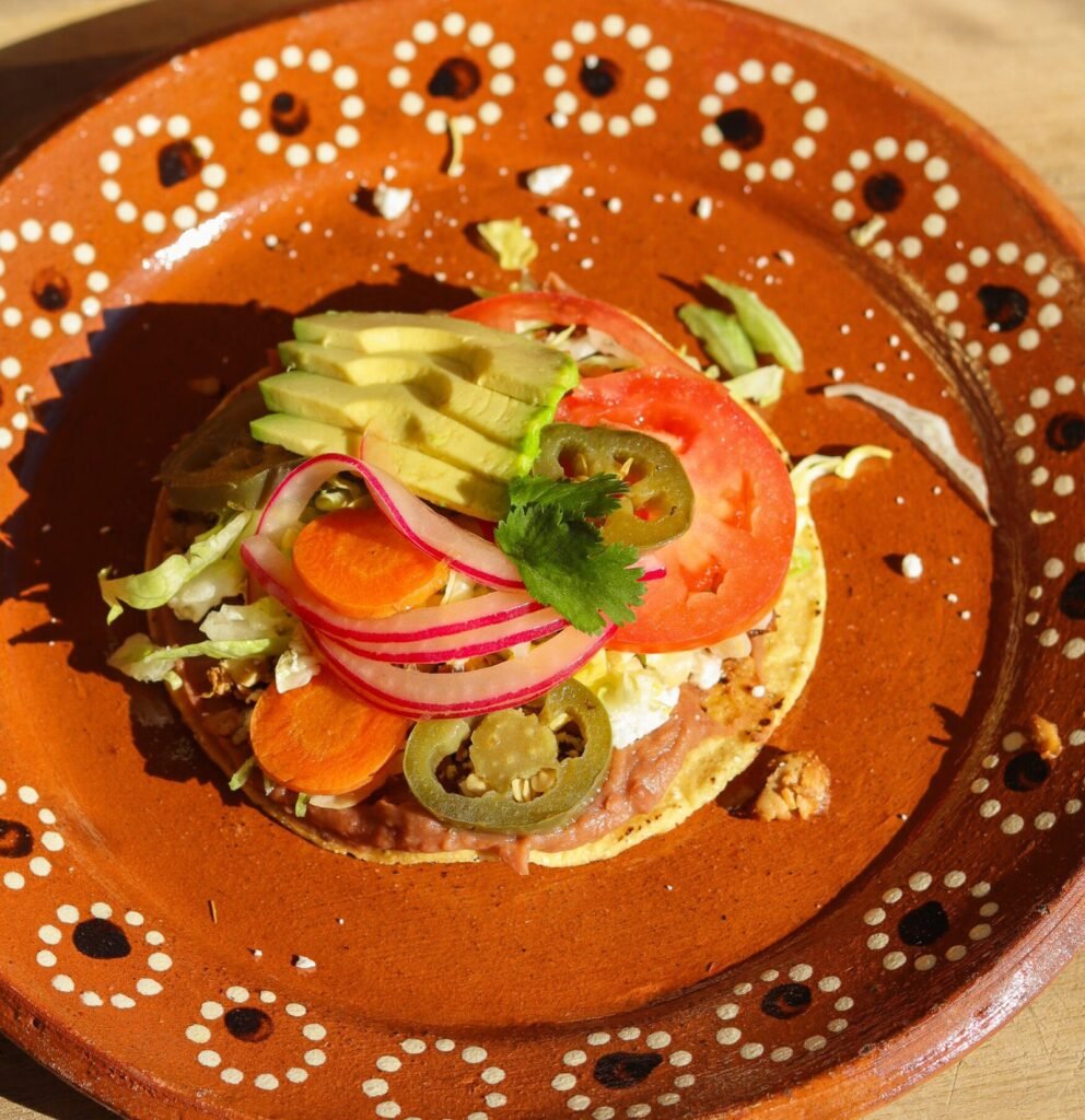 delicious tostada on a mexican plate.