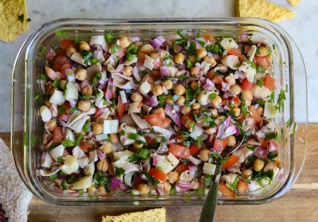 plant based ceviche recipe with hearts of palm, mushrooms, and chickpeas.