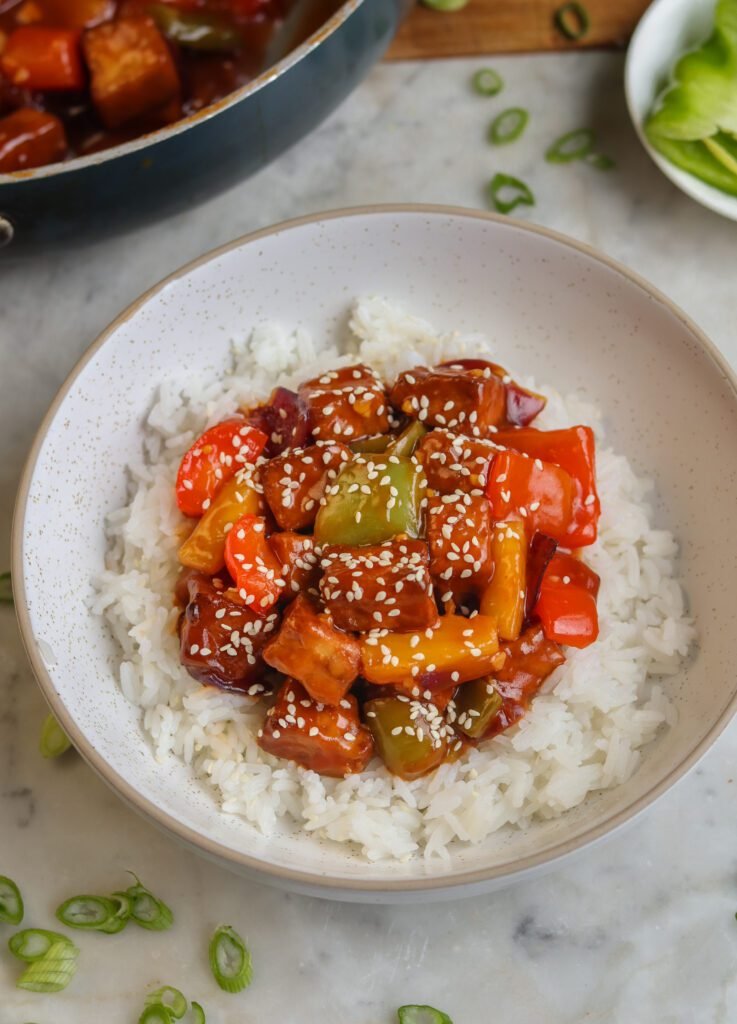 the best saucy tofu with rice in a bowl.