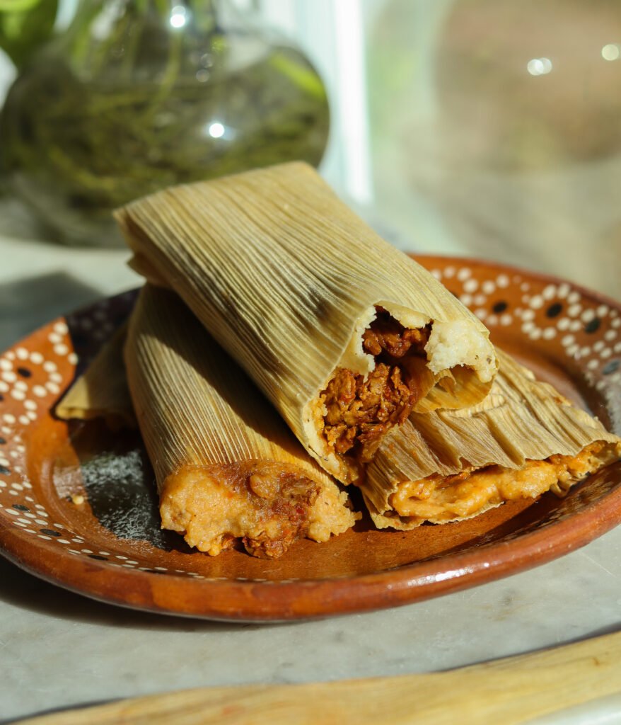 tamales on a mexican plate.