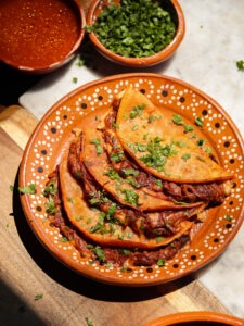 vegan birria tacos on a Mexican plate.