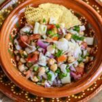 vegan ceviche in a Mexican bowl with tortilla chips.