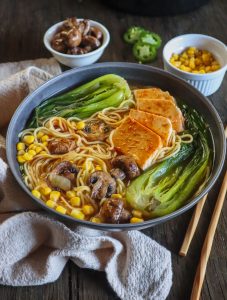 vegan ramen in a wide bowl with veggies.
