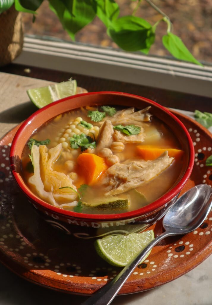 vegan caldo de pollo mexican vegetable soup in a bowl.