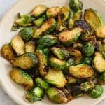 air fried brussels on a beige plate.