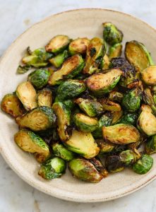 air fried brussels on a beige plate.