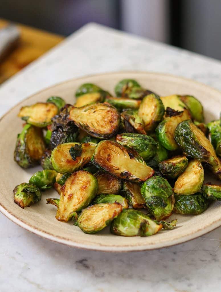 brussel sprouts on a white bowl.
