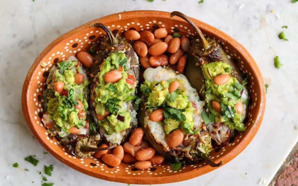 vegan stuffed jalapenos on a plate.