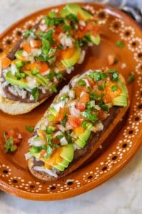 molletes on an authentic mexican plate.