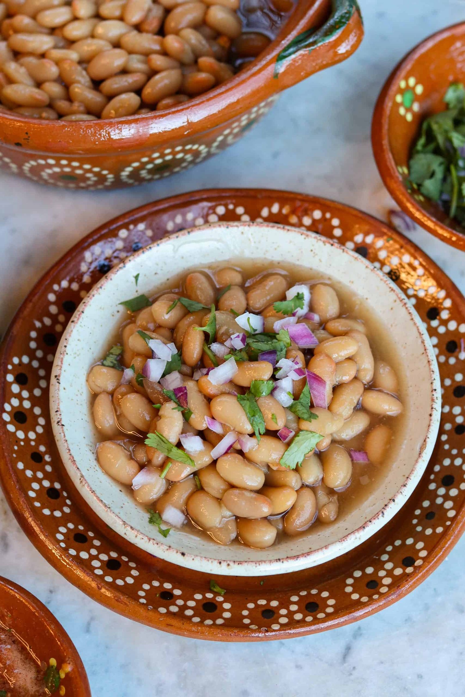 frijoles de la olla in a mexican bowl for heart healthy meal ideas.