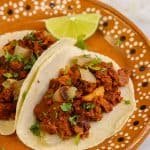 vegan al pastor tacos on a Mexican dish.