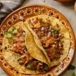 Shredded Tofu Tacos on a mexican plate.