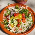 healthy cabbage salsa in a ceramic bowl.