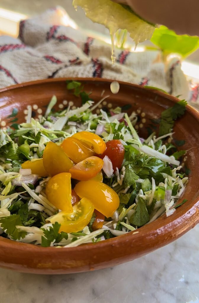 Mexican coleslaw recipe in a mexican bowl.