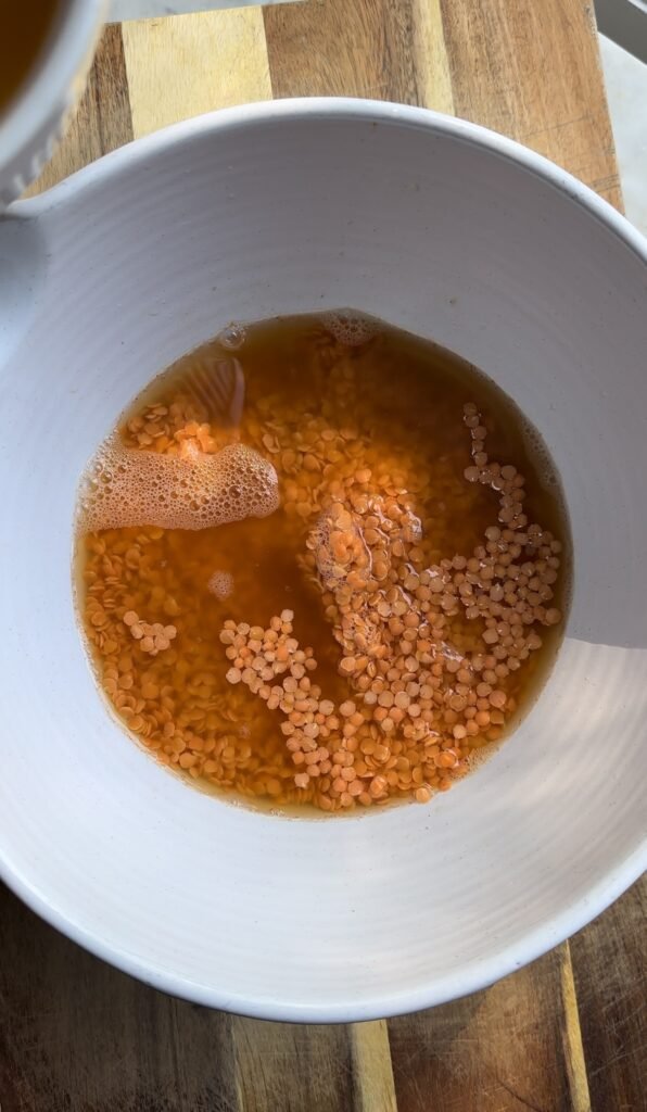 red lentils in a bowl soaking.