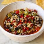 salsa macha in a little bowl with tortilla chips.