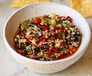 salsa macha in a little bowl with tortilla chips.