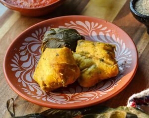 corundas on a mexican plate.