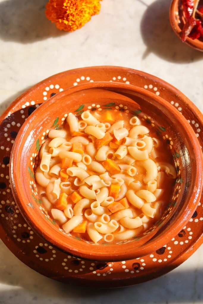 sopa de coditos in a mexican bowl.