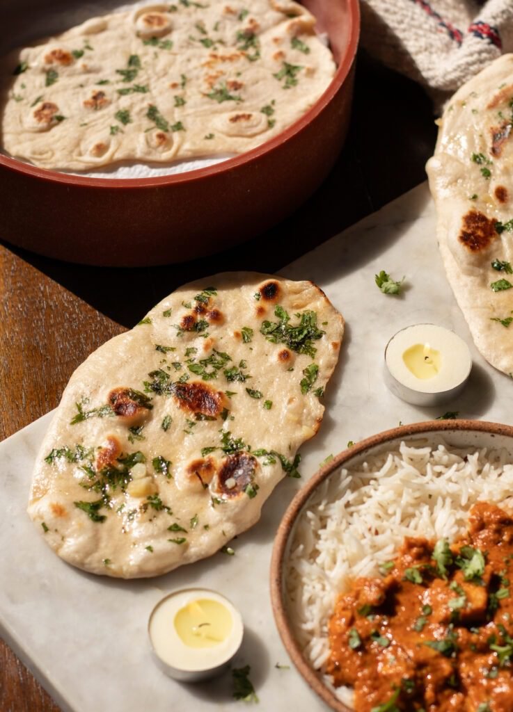 garlic naan recipe with curry on the side.