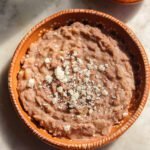 mexican vegan refried beans in a plate.