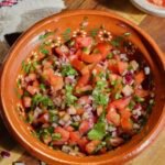 pico de gallo recipe in a mexican bowl.