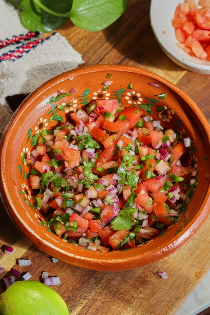 pico de gallo recipe in a mexican bowl.