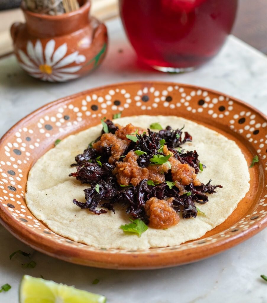 hibiscus tacos on a mexican plate.