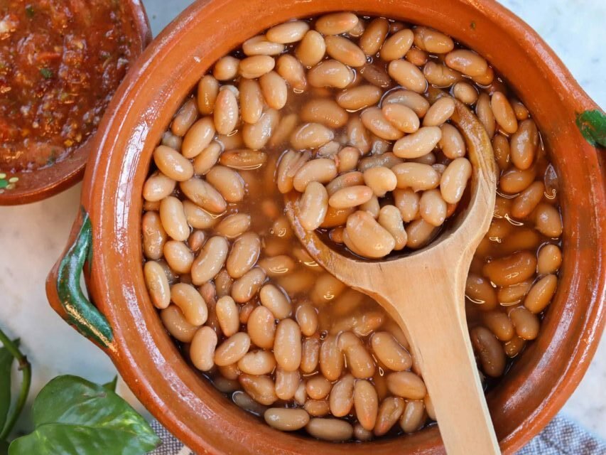 frijoles de la olla in a mexican pot.