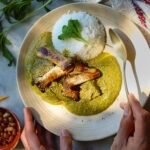 mole verde on a plate with rice.