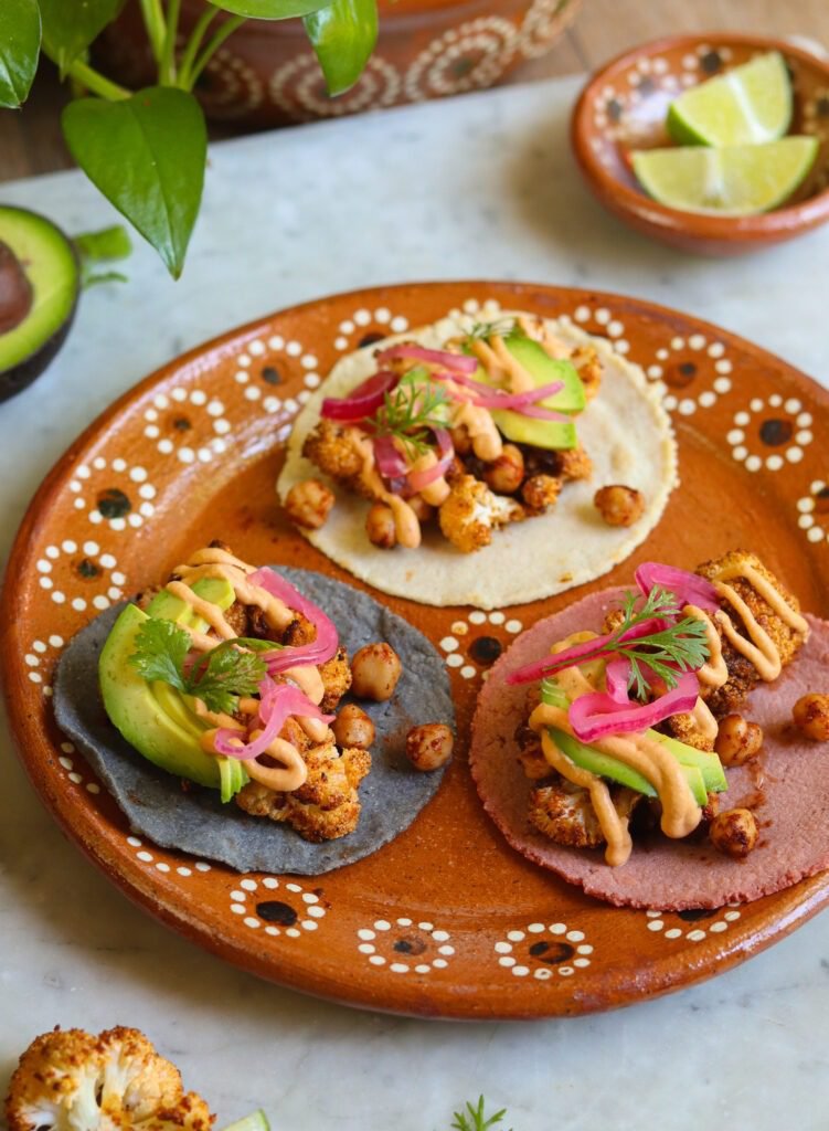 veggie cauliflower tacos on a mexican plate.