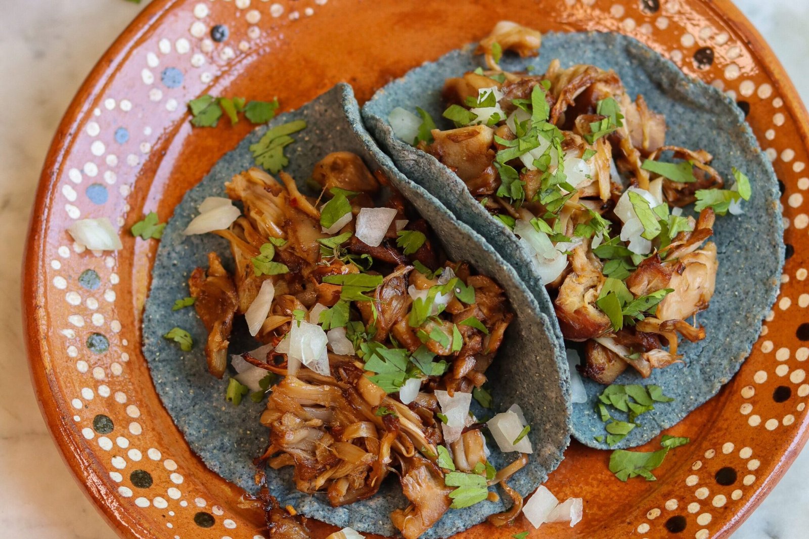 Homemade Corn Tortilla recipe jackfruit tacos on a mexican plate.