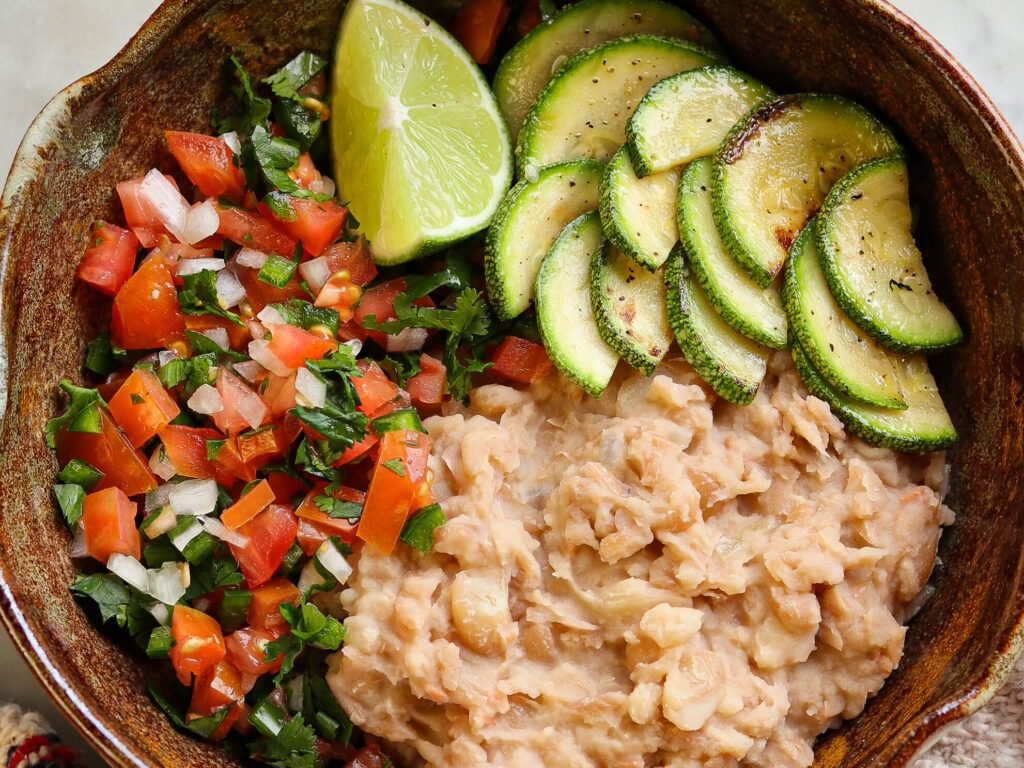 refried beans in a burrito bowl mexican style.