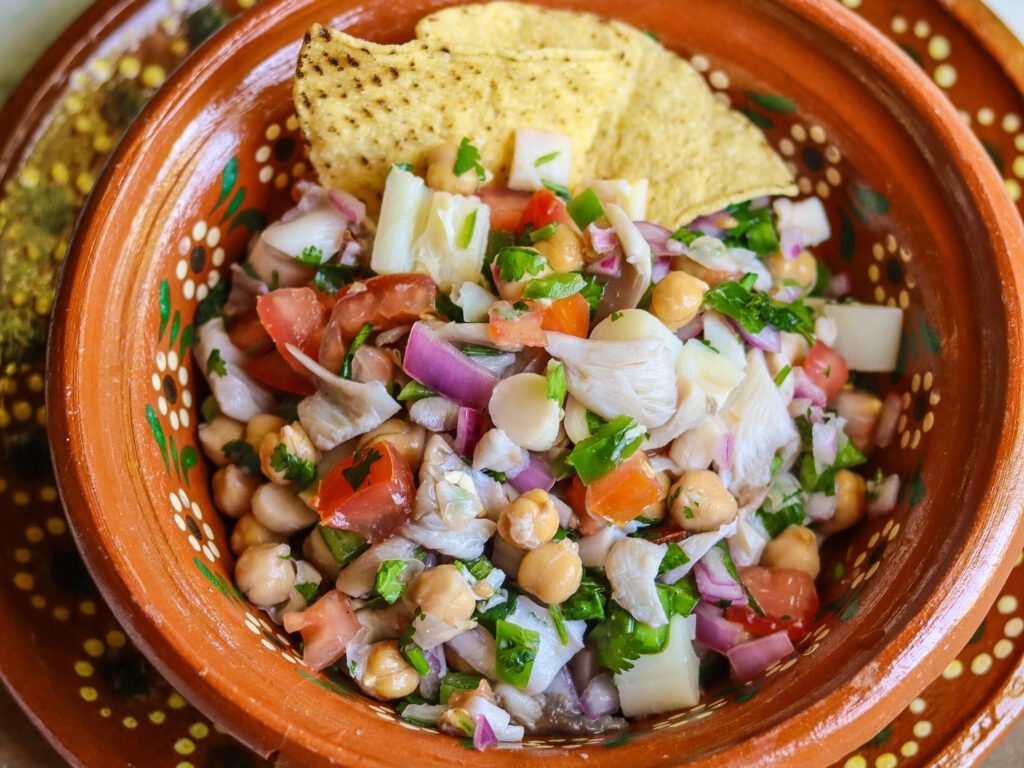 vegan ceviche in a Mexican bowl with tortilla chips.