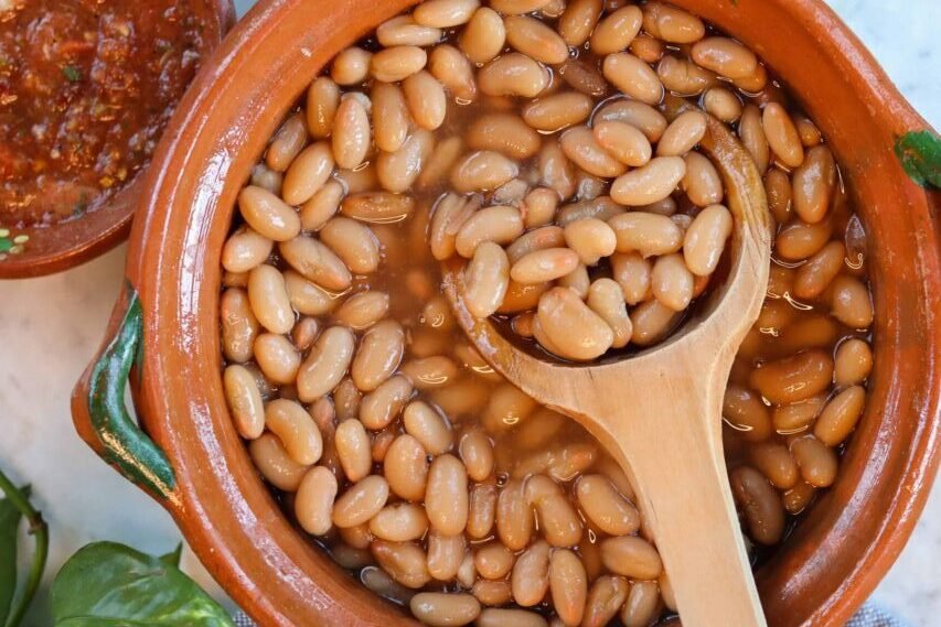 frijoles de la olla in a mexican pot.