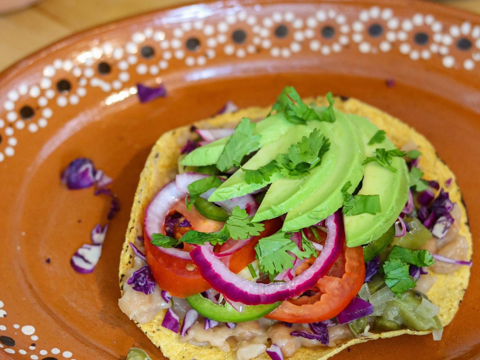 tostadas de papa potato tostada on a mexican plate.