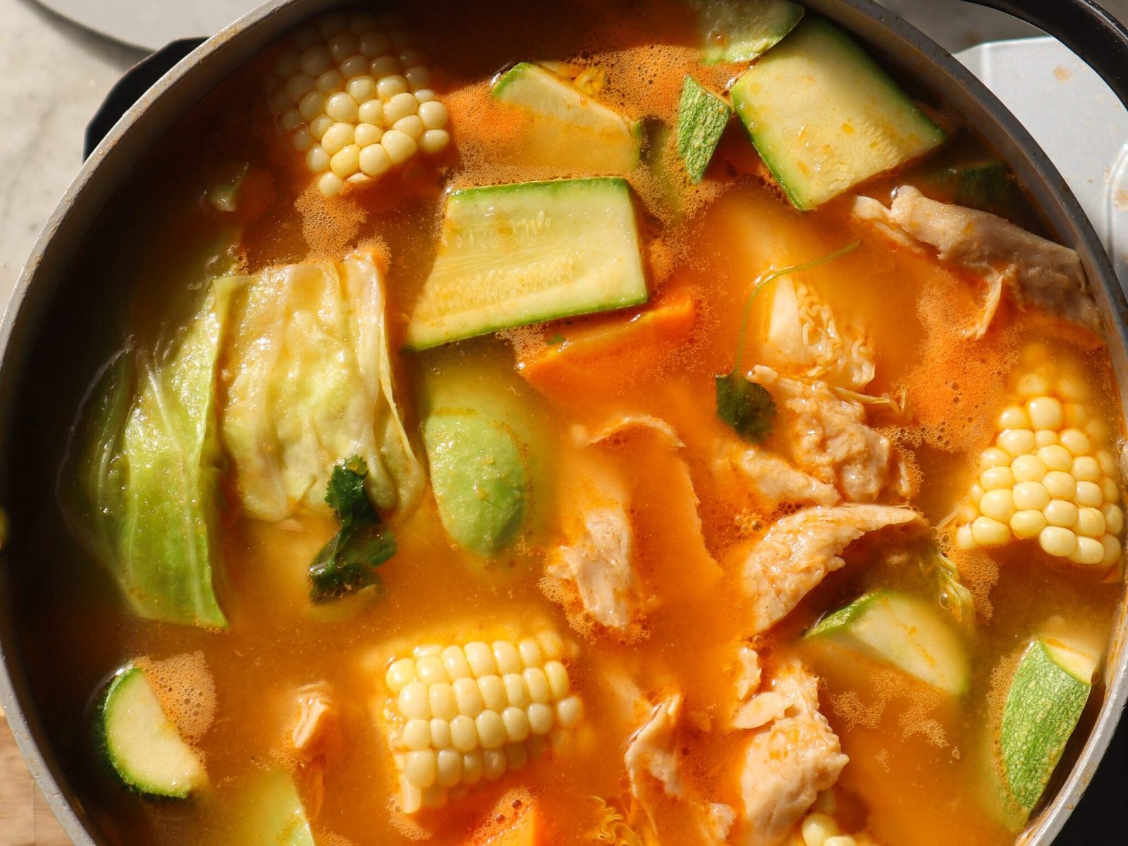 vegan caldo de pollo recipe in a pot.