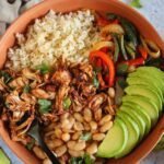 vegan burrito bowl with toppings.