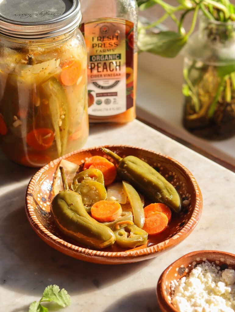 mexican escabeche recipe aka pickled jalapenos plated on a mexican dish.