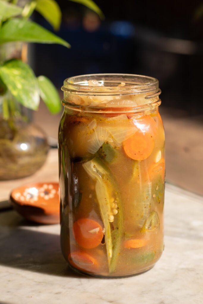 Pickled jalapenos recipe in a glass jar.