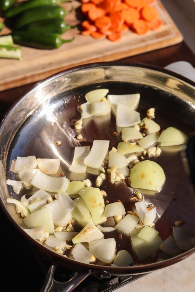 saute garlic and onion in a pan.