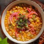 chayote soup in a bowl with toppings.