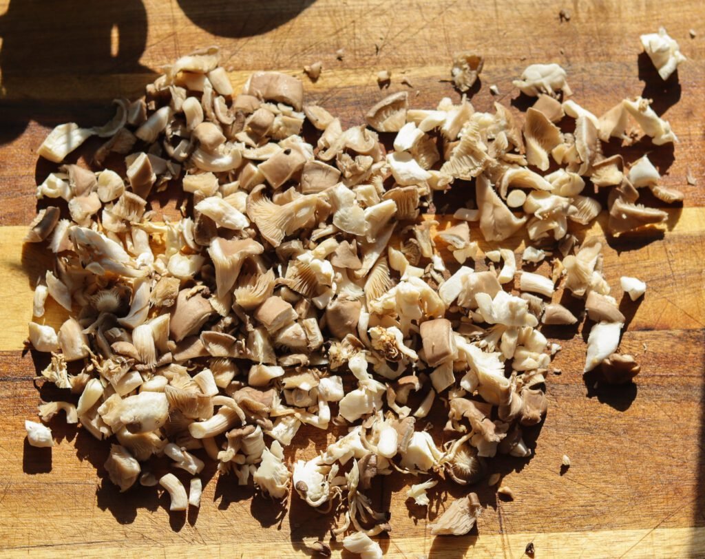 diced mushrooms on a cutting board.