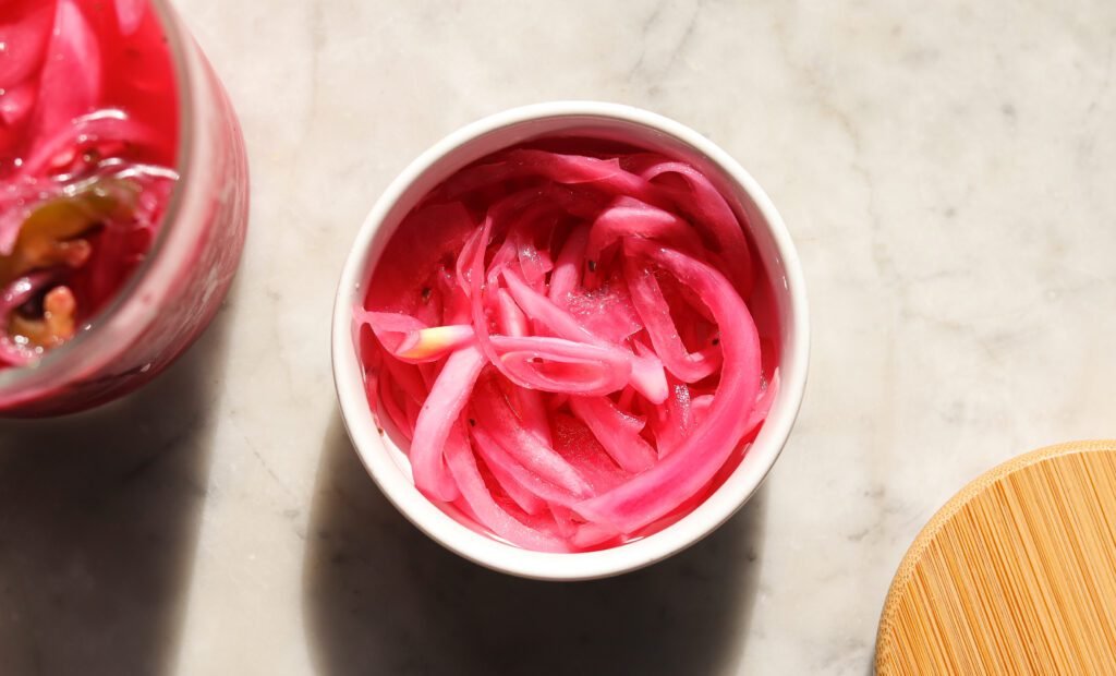 pickled red onion in a small bowl.