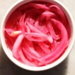 pickled red onion in a small bowl.