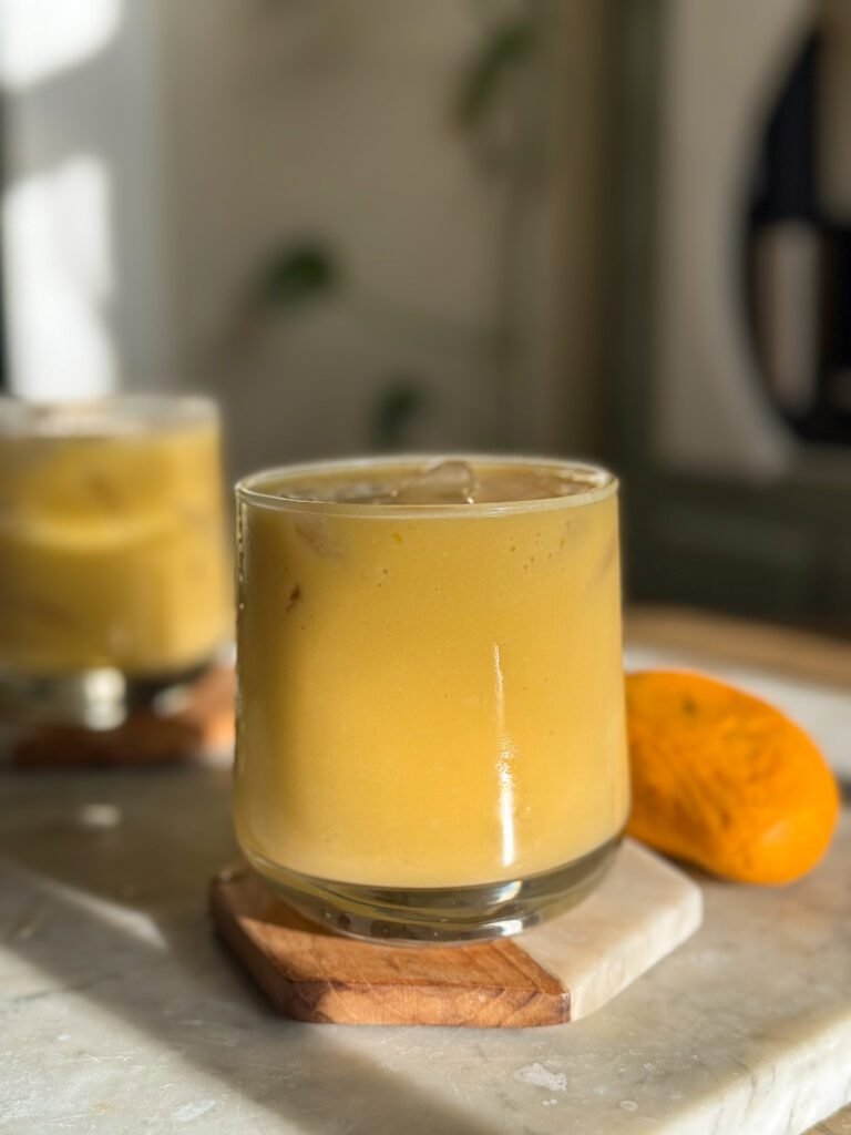 mango milk served in a glass.